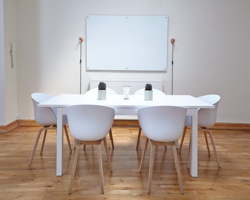 An elegantly arranged workspace table with clean stationary materials under natural light